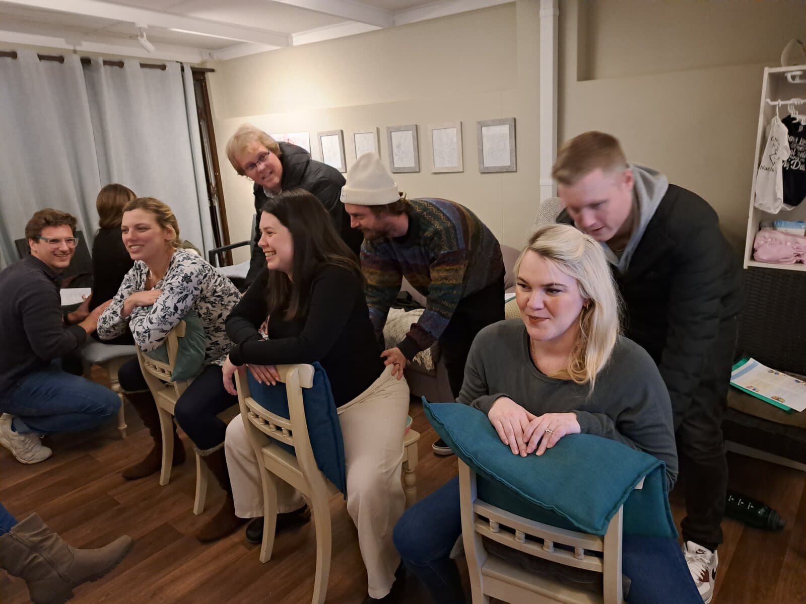 Couples laughing together at an antenatal class