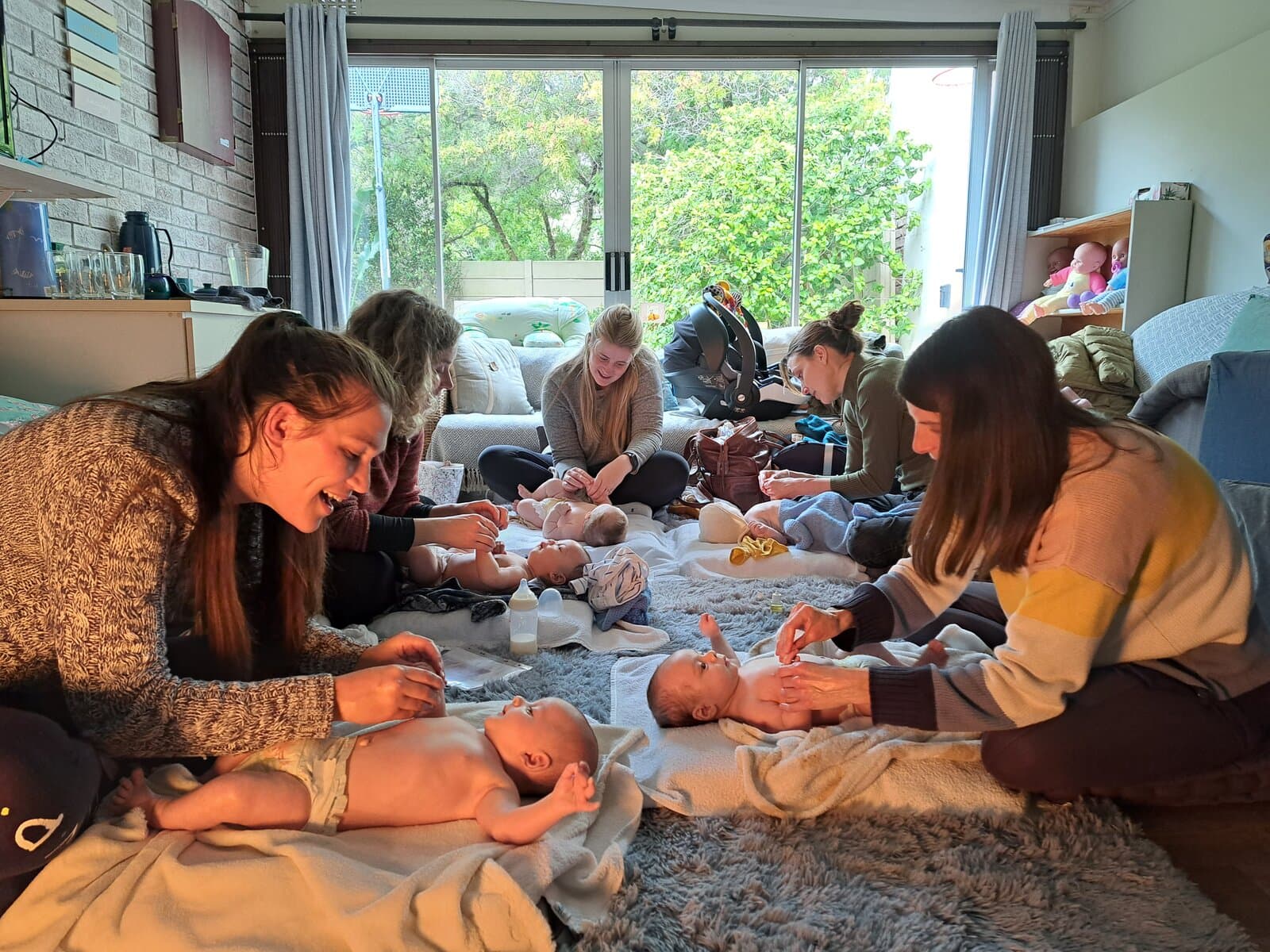 Mums massaging their babies during a baby massage class